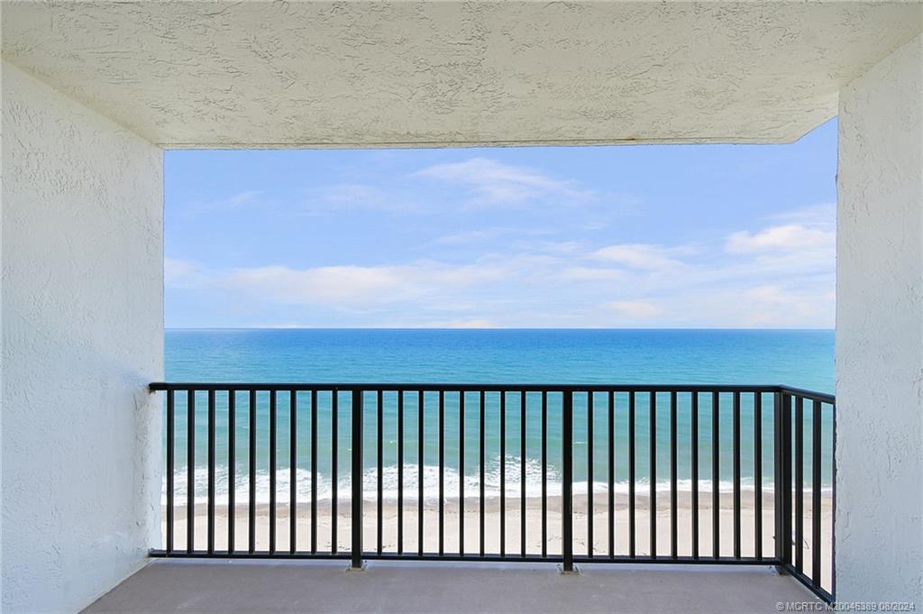 a balcony with a book shelf