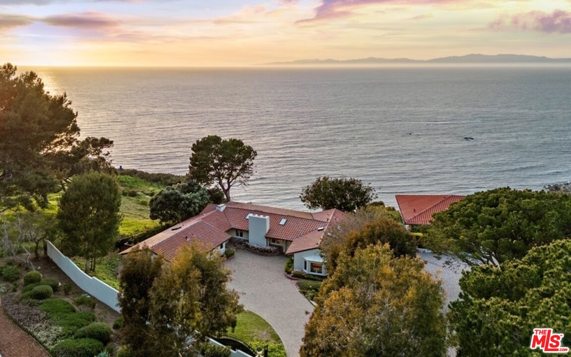 a aerial view of a house with a lake view