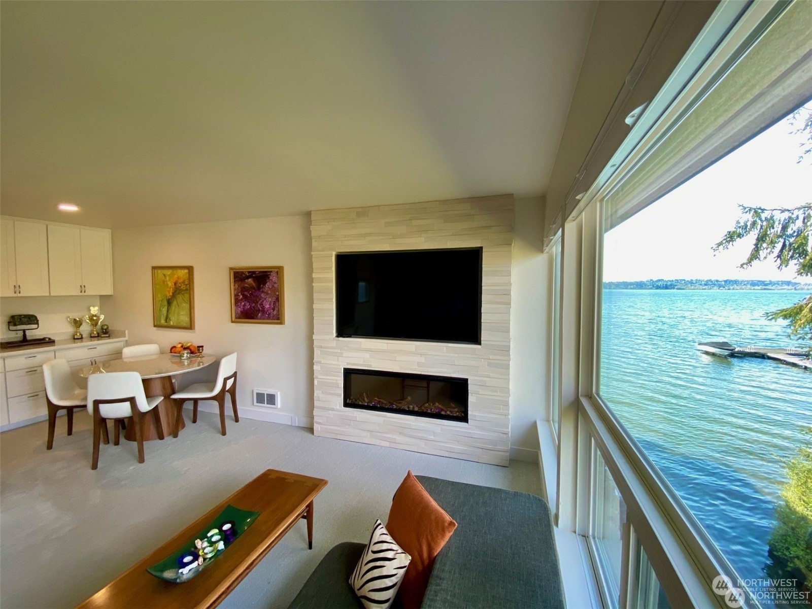 a living room with furniture flat screen tv and a fireplace