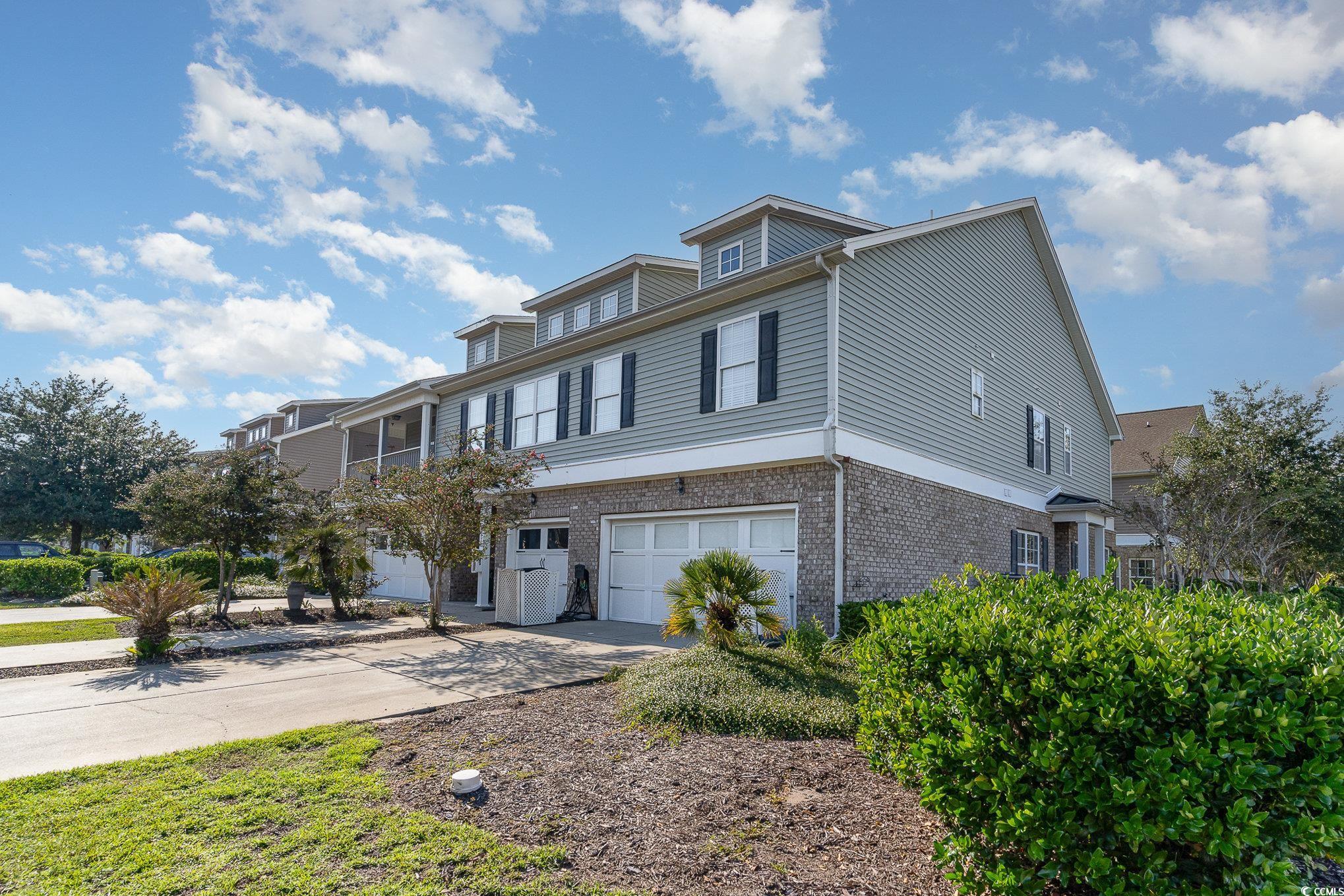 View of front of property with a garage