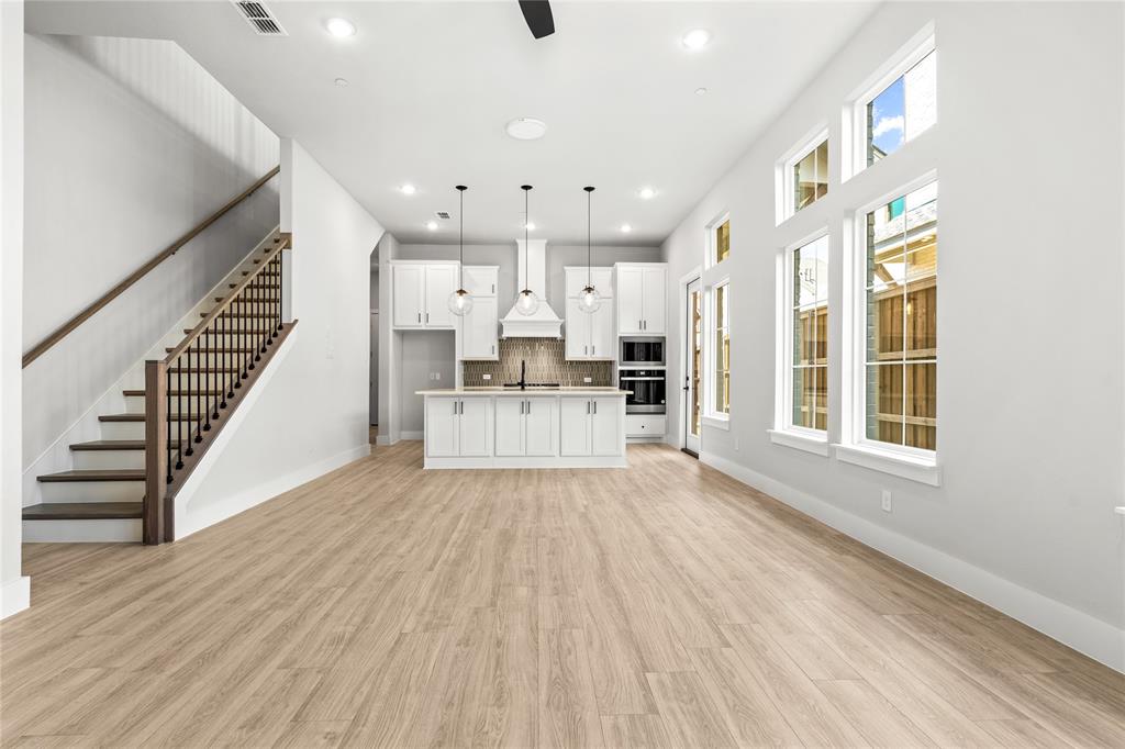 a view of kitchen with furniture and wooden floor