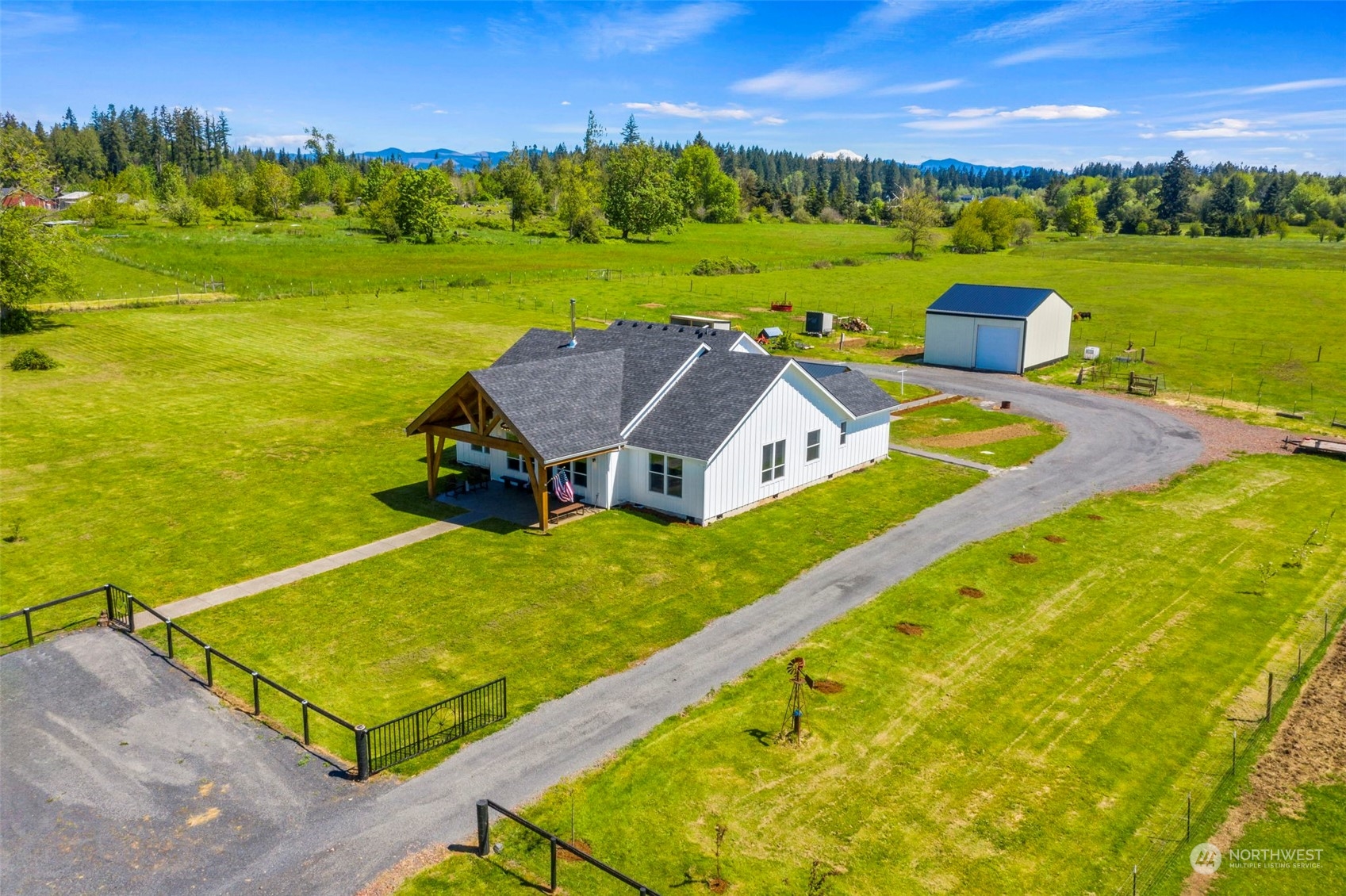 an aerial view of a house with a ocean view