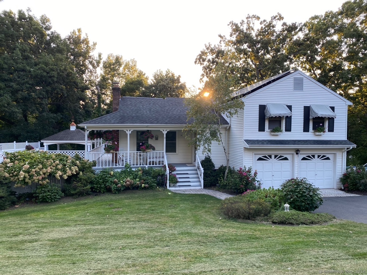 a front view of a house with a garden