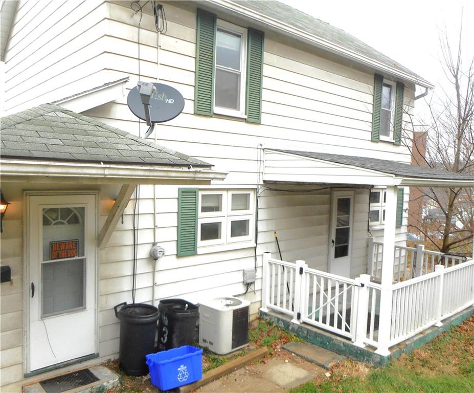 a front view of a house with a porch