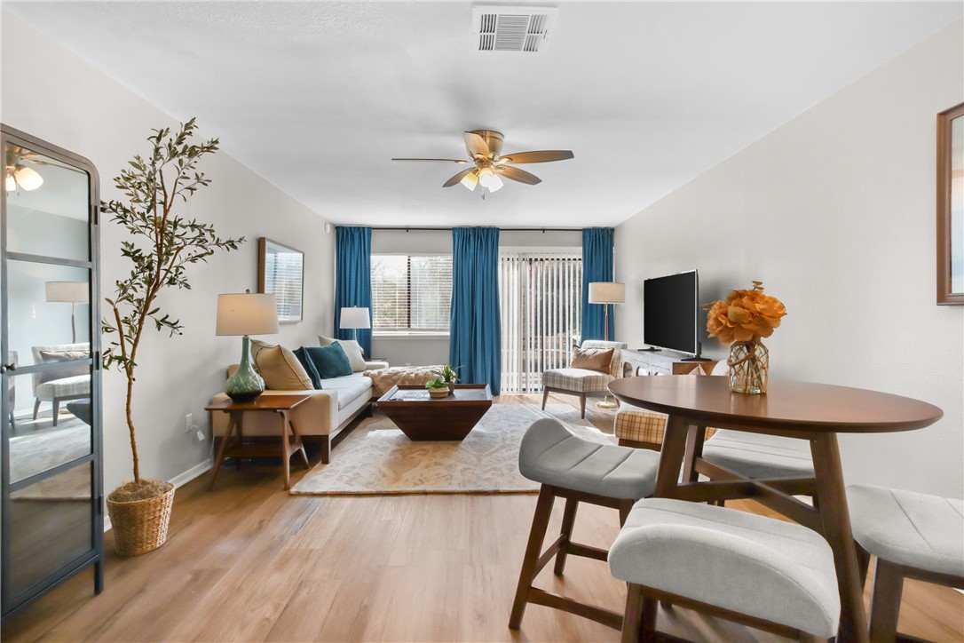 a view of a livingroom with furniture and a flat screen tv