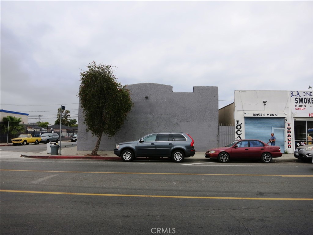 a view of street with parked cars