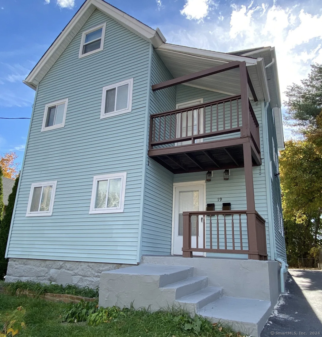 a front view of a house with garage