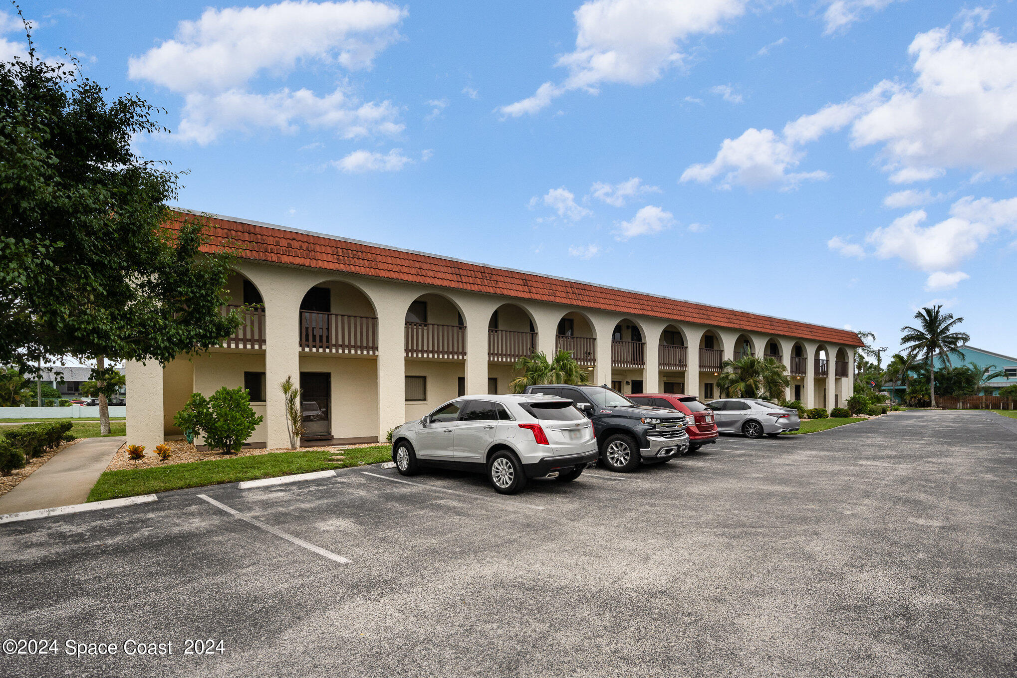 a front view of a house with parking space