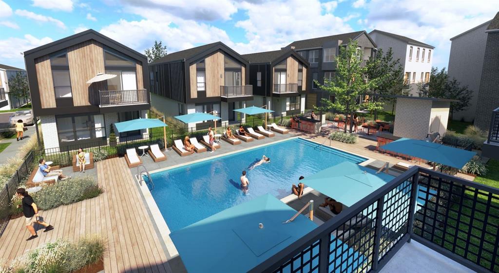 a view of a house with pool and sitting area