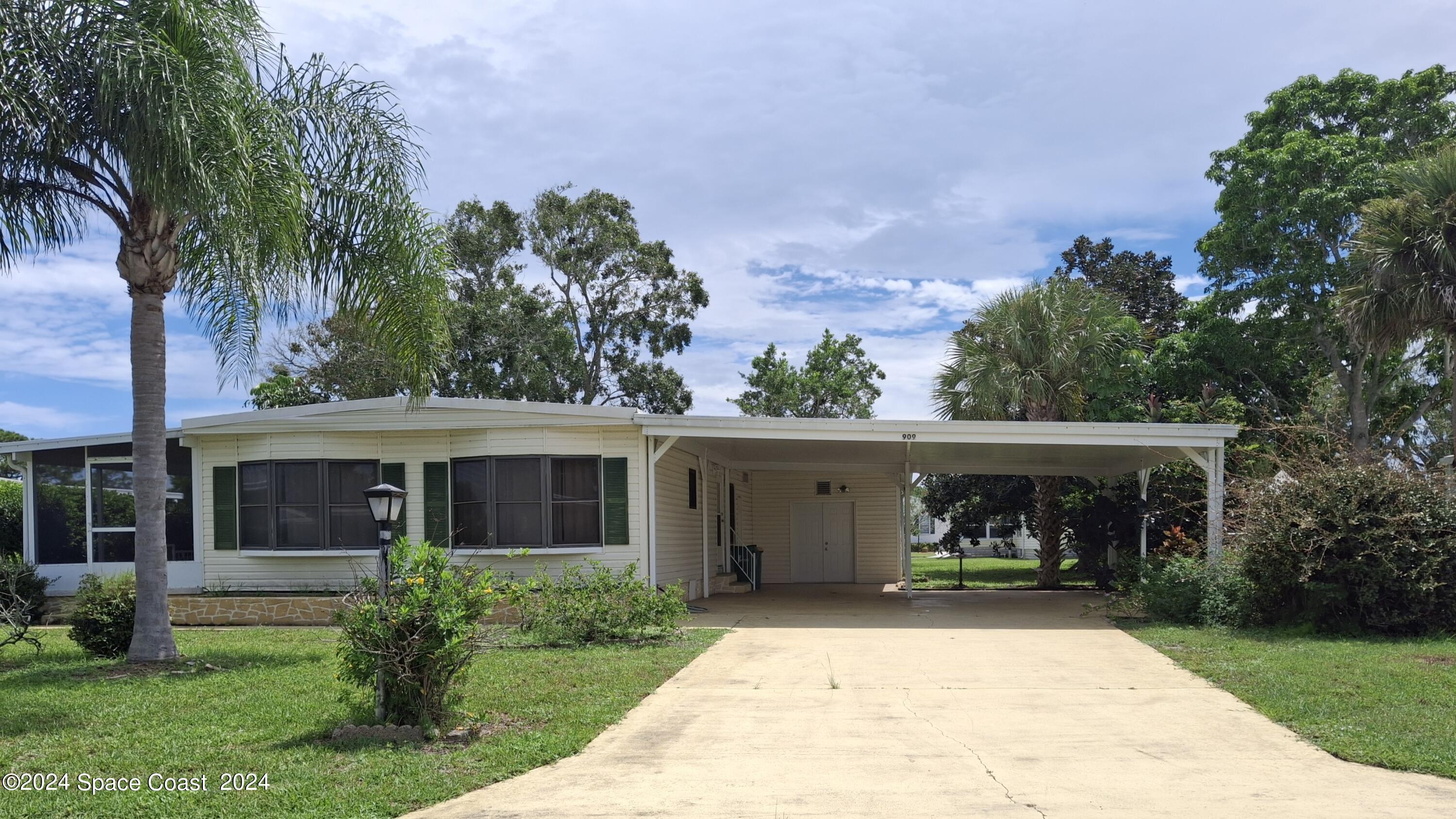 front view of a house with a yard