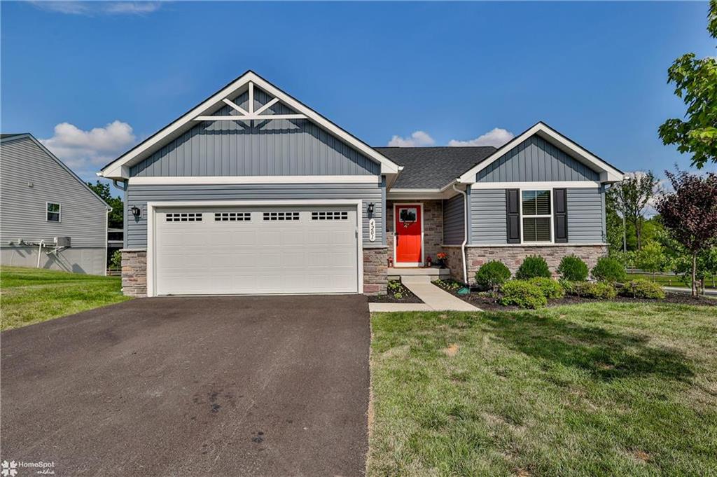 a front view of a house with garage