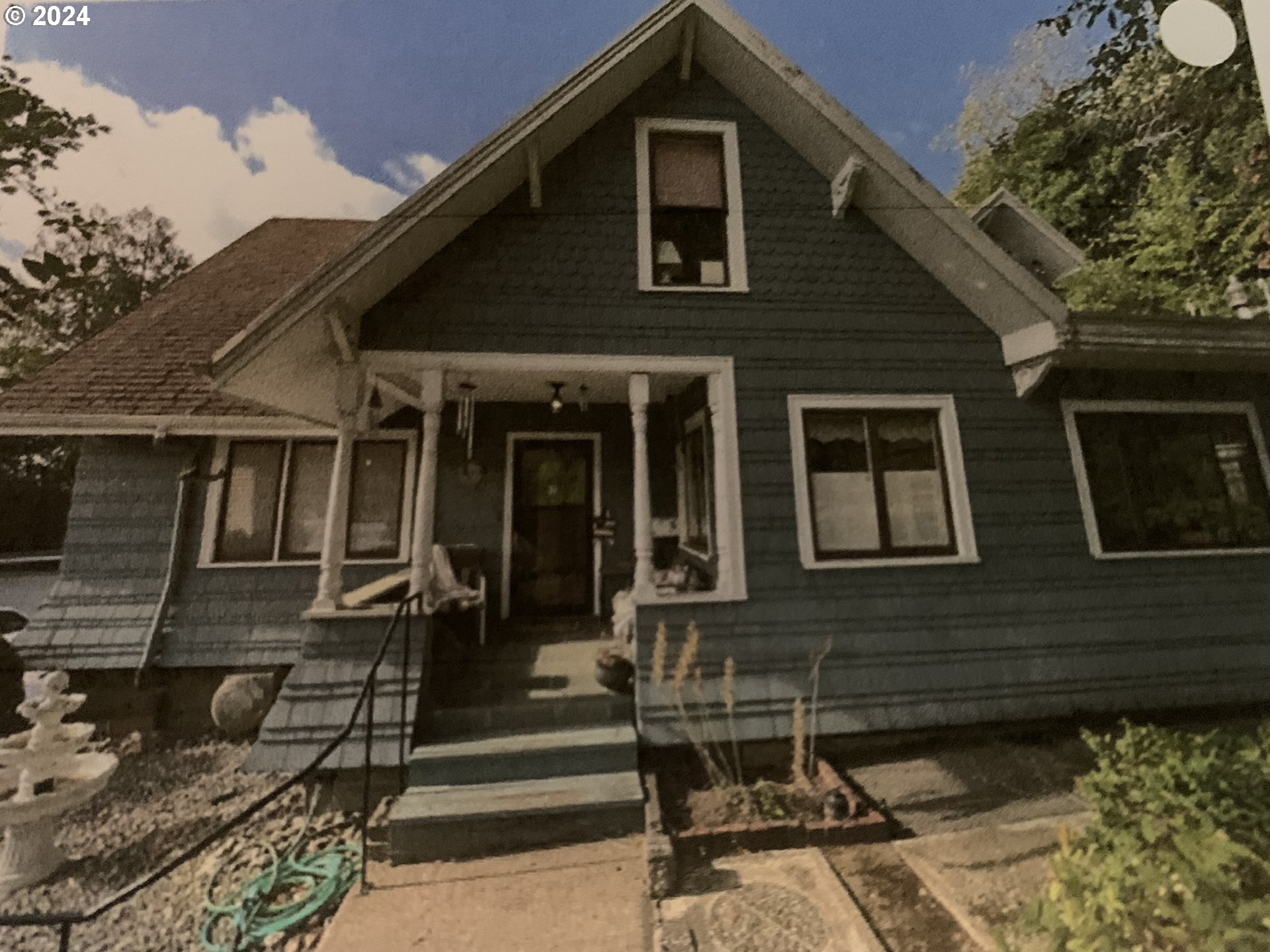 a front view of a house with stairs