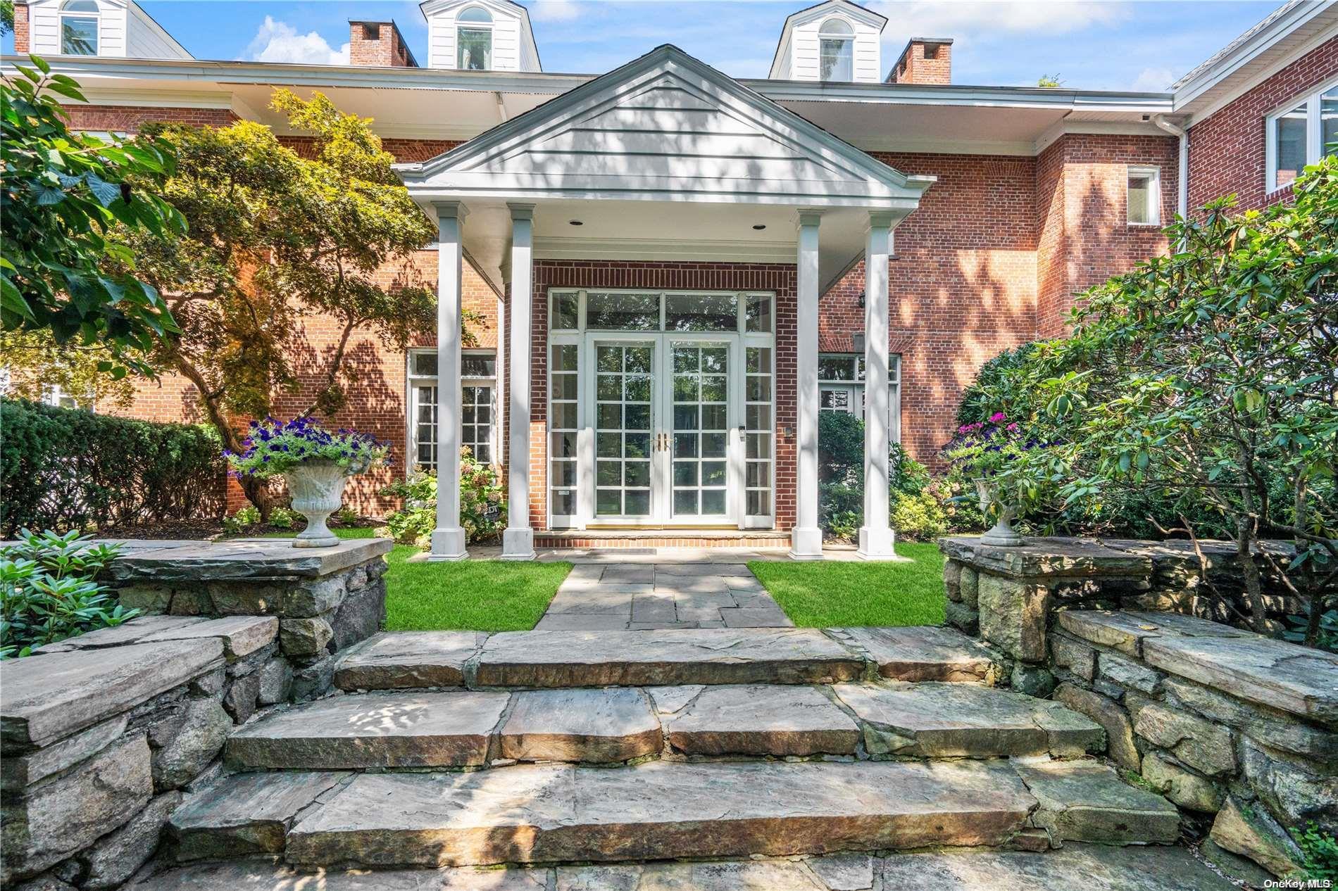 Grand entrance to home with French doors