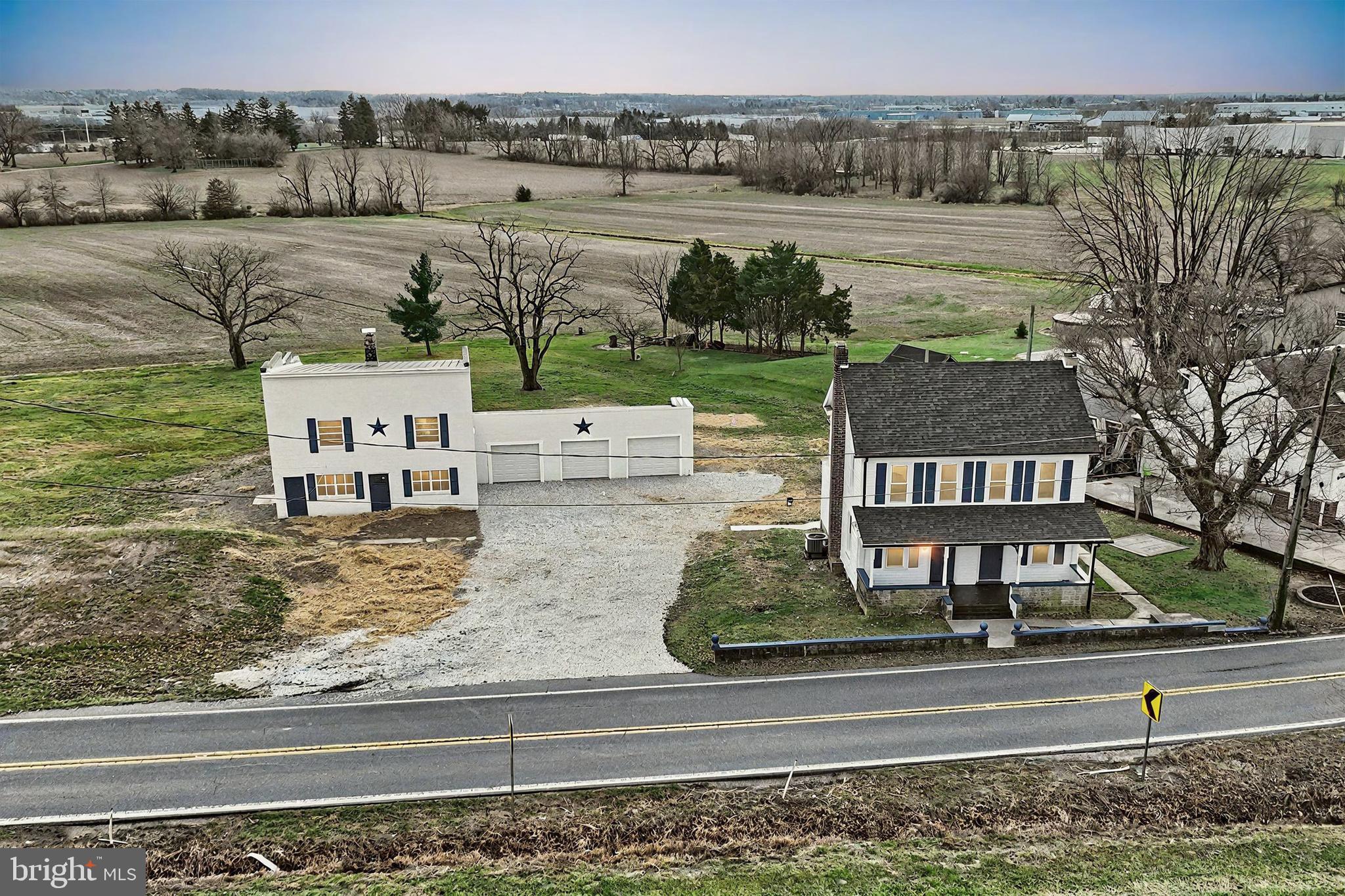 aerial view of a house with a yard