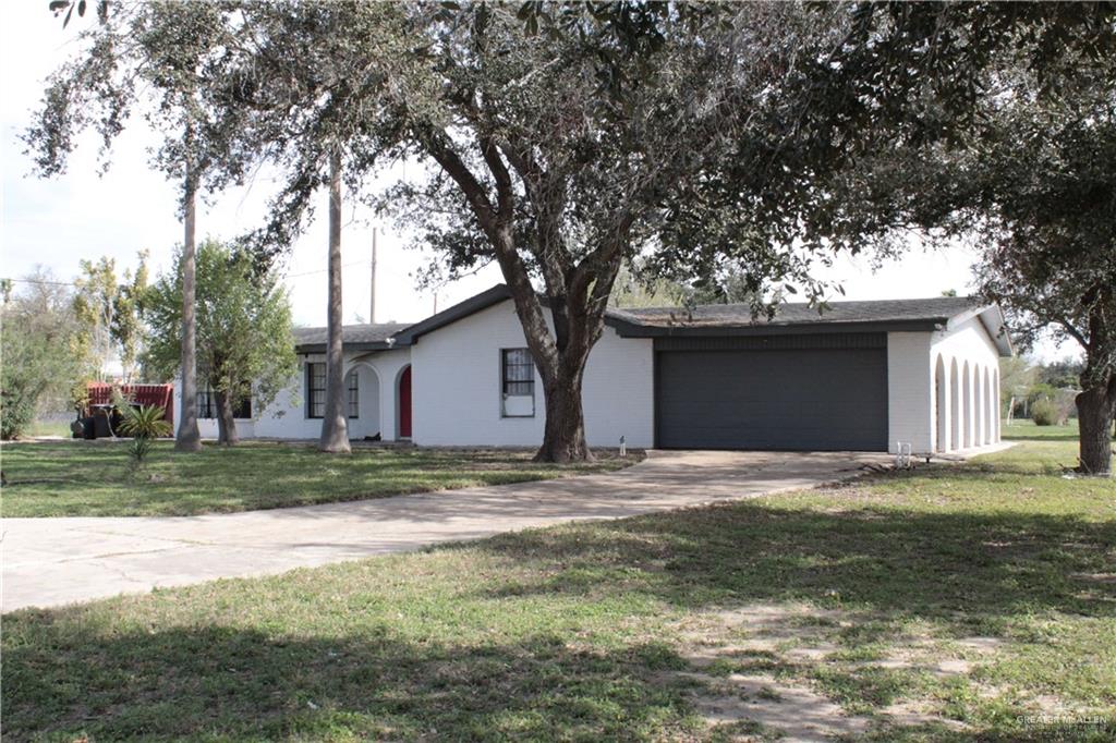 a house that has a tree in front of it