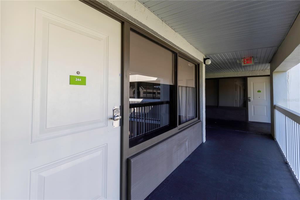 a view of hallway with cabinets