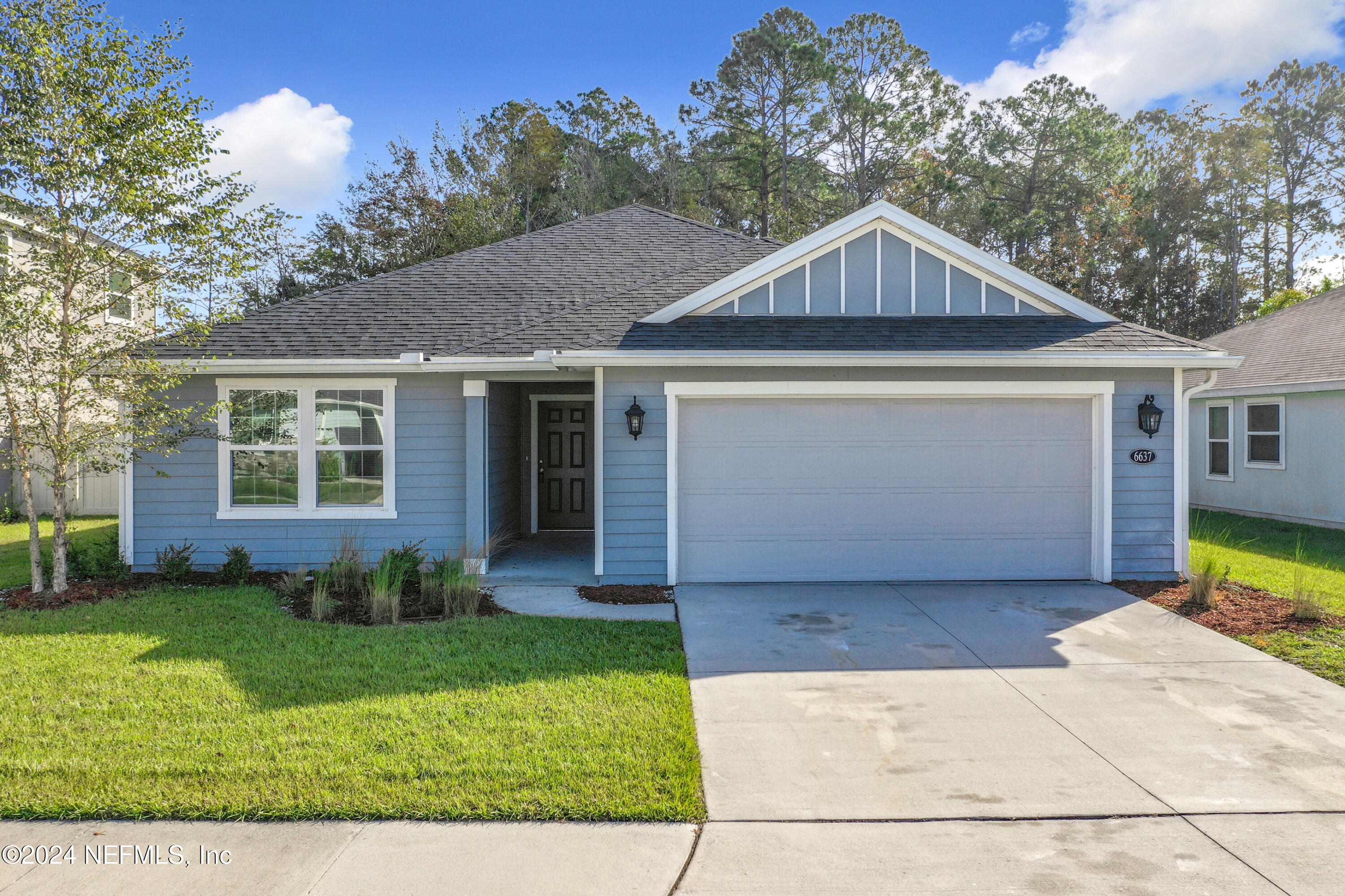 front view of a house and a yard