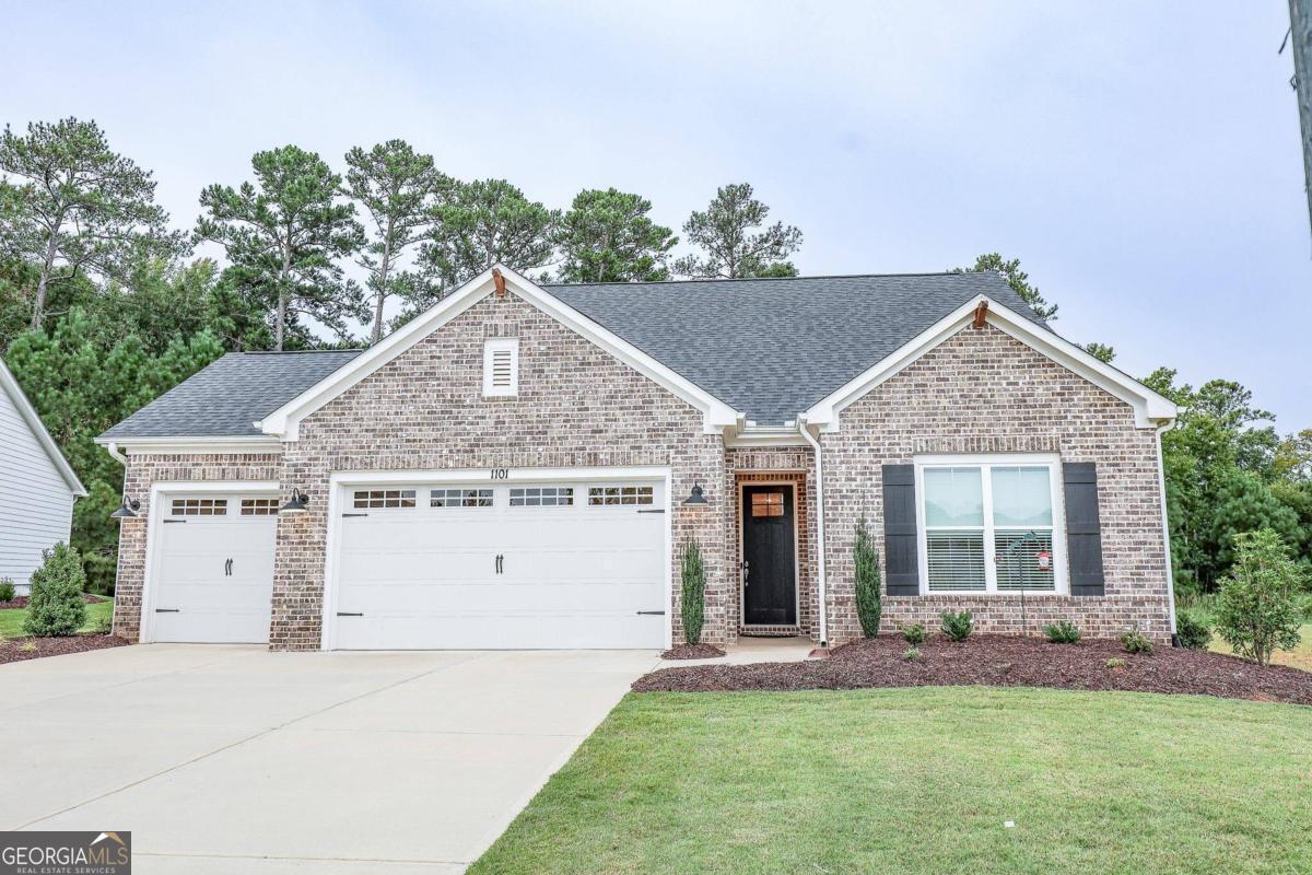 a view of house with yard and entertaining space