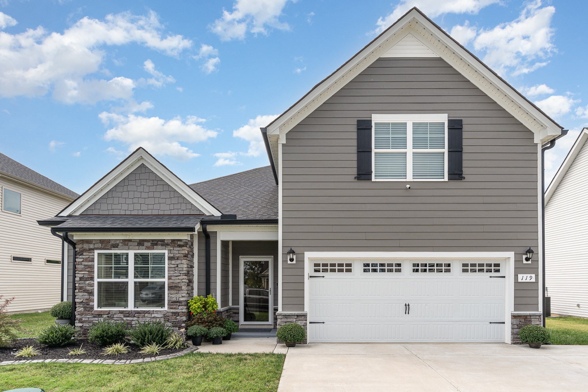 a front view of a house with a yard