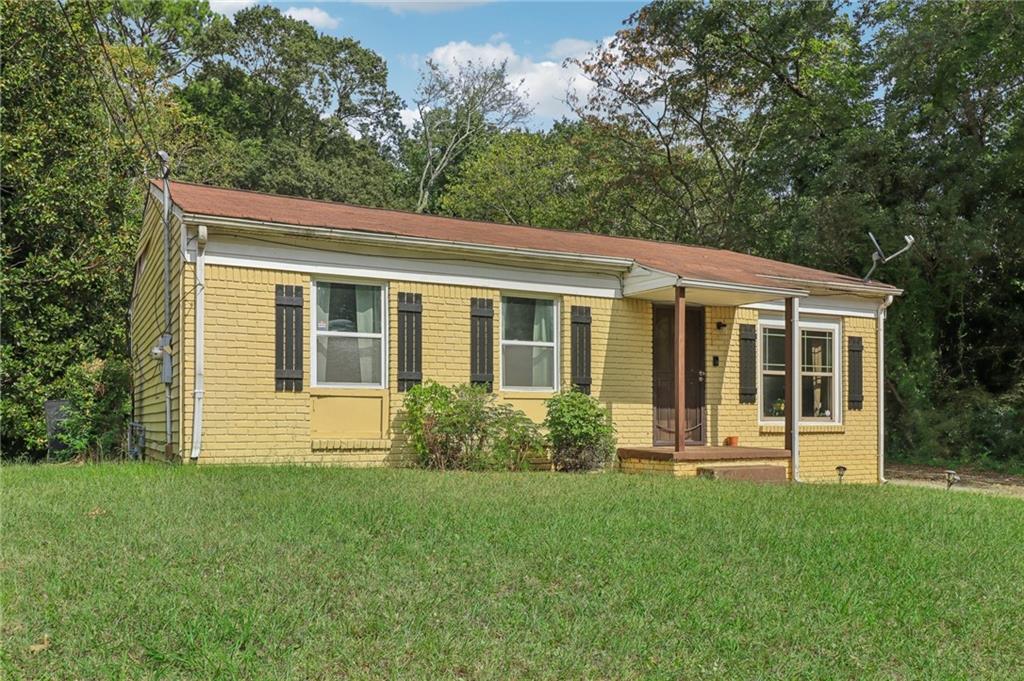 a front view of a house with a yard