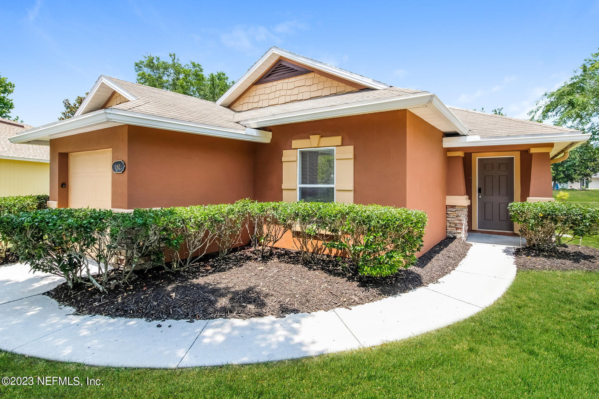 front view of a house with a yard