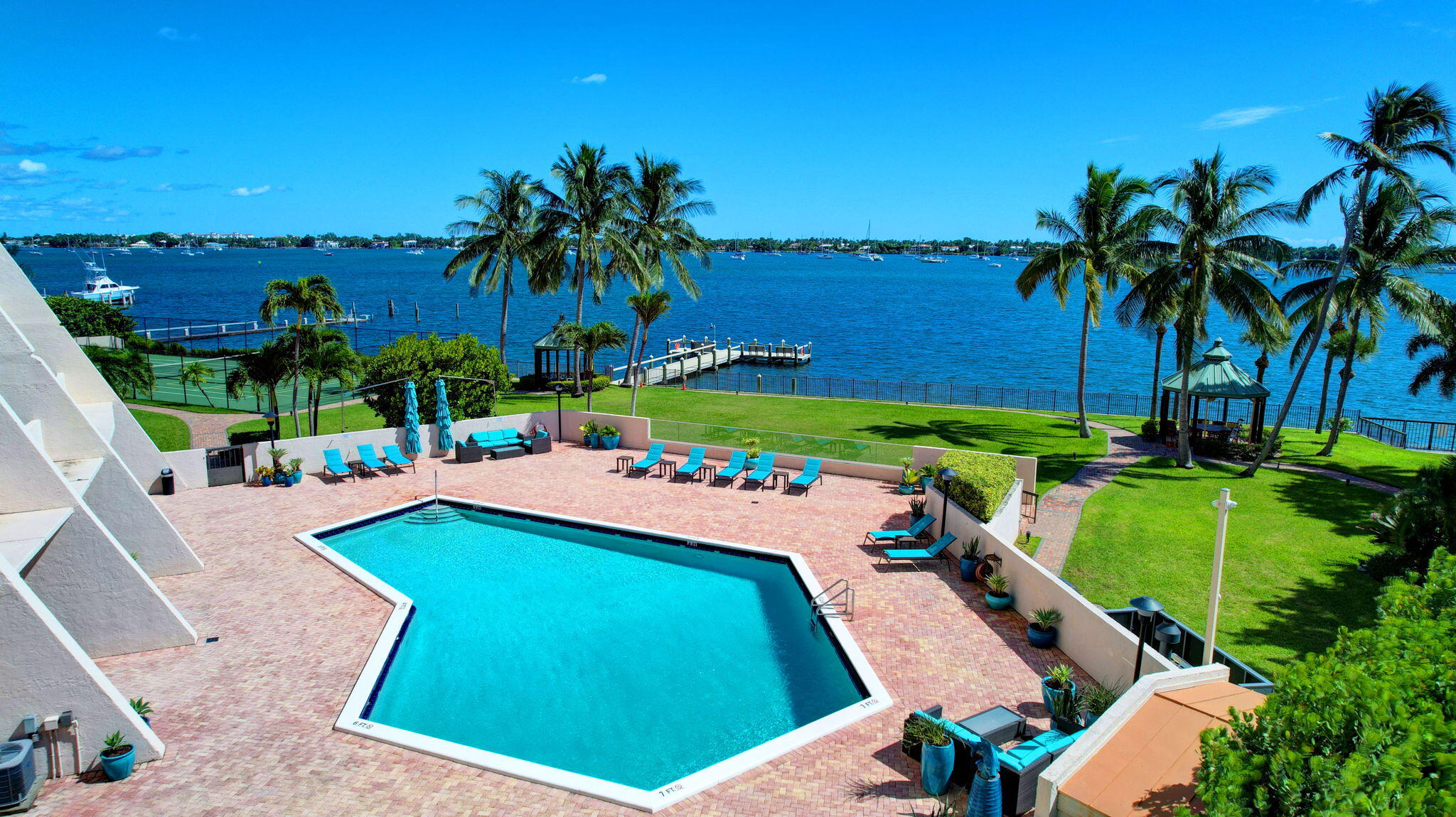 a view of a backyard with swimming pool