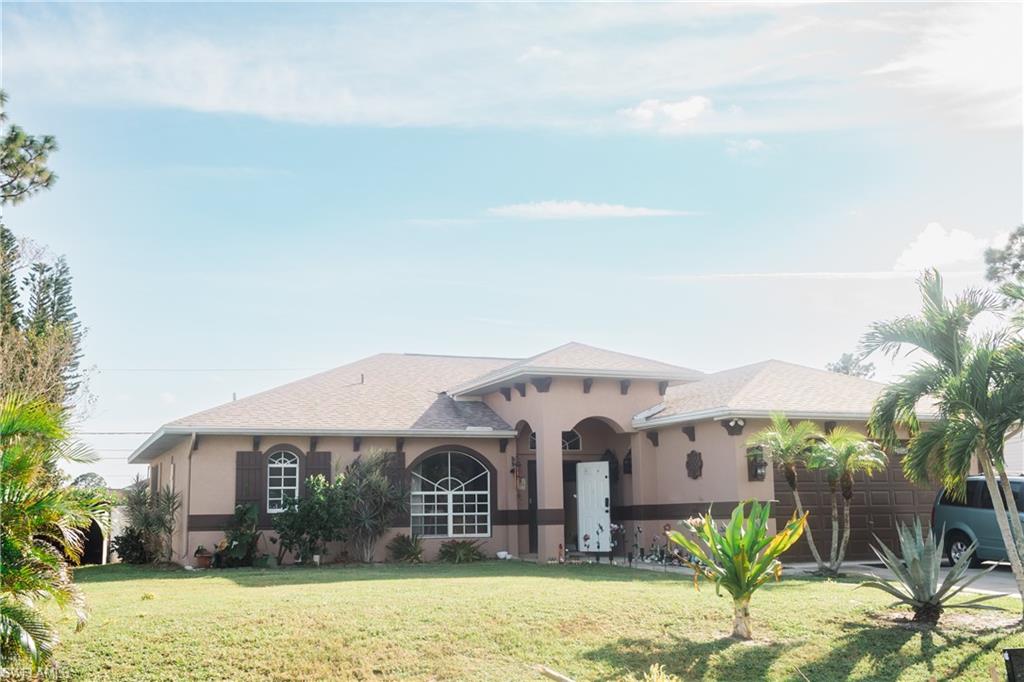 a front view of house with yard and seating