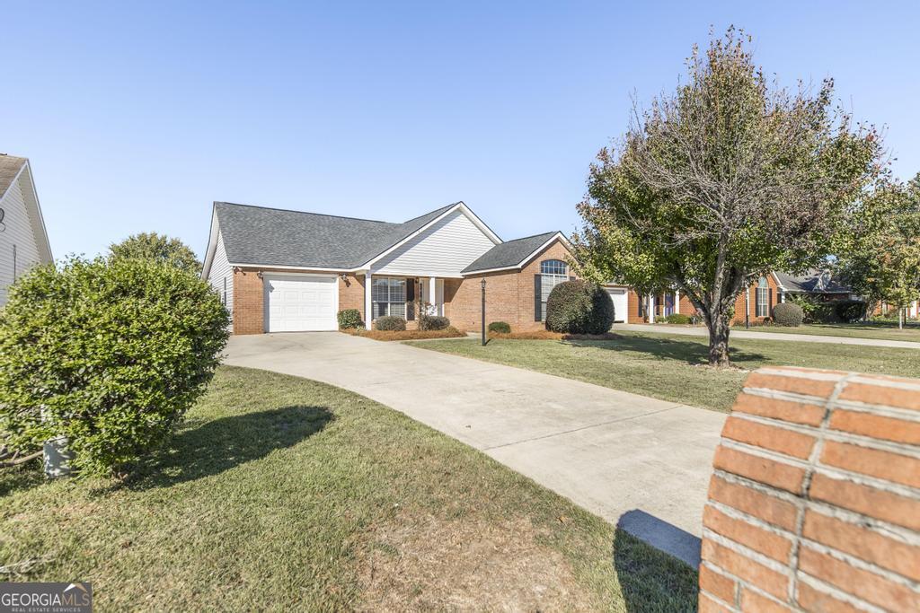 a front view of a house with a yard