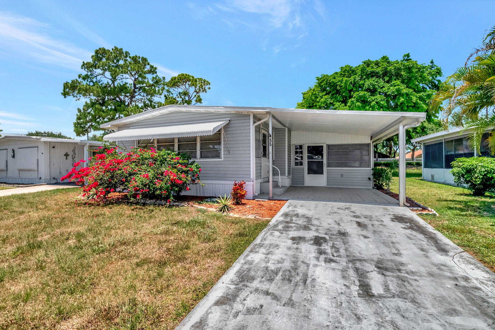 a front view of a house with an yard