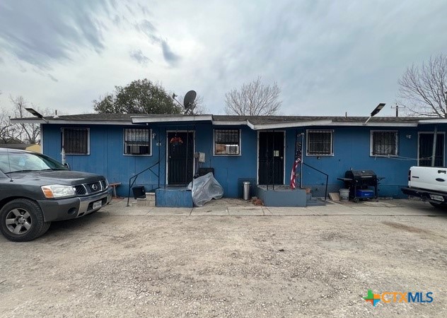 a front view of a house with parking space