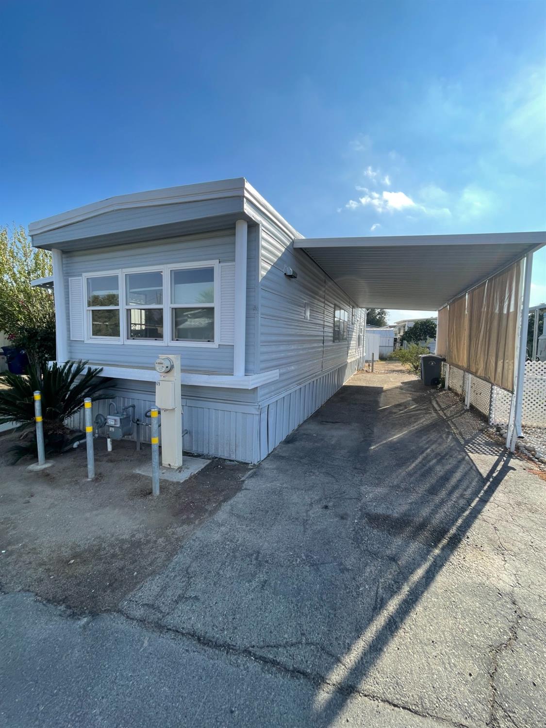 a view of house with deck and outdoor seating