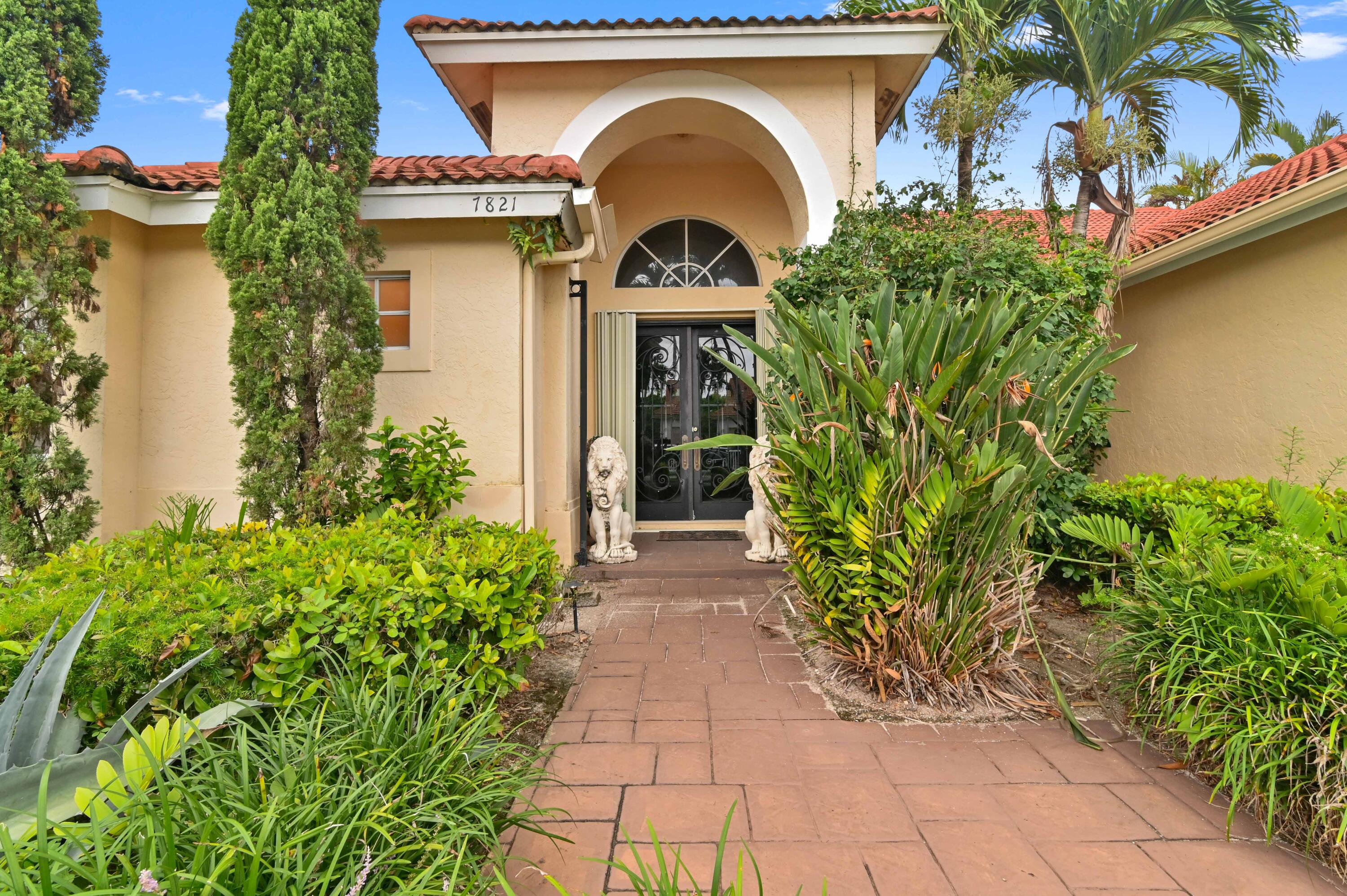 a front view of a house with garden