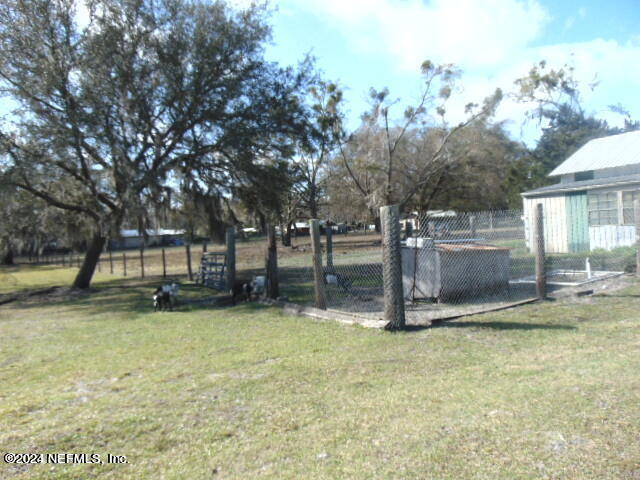 a view of a yard with pool