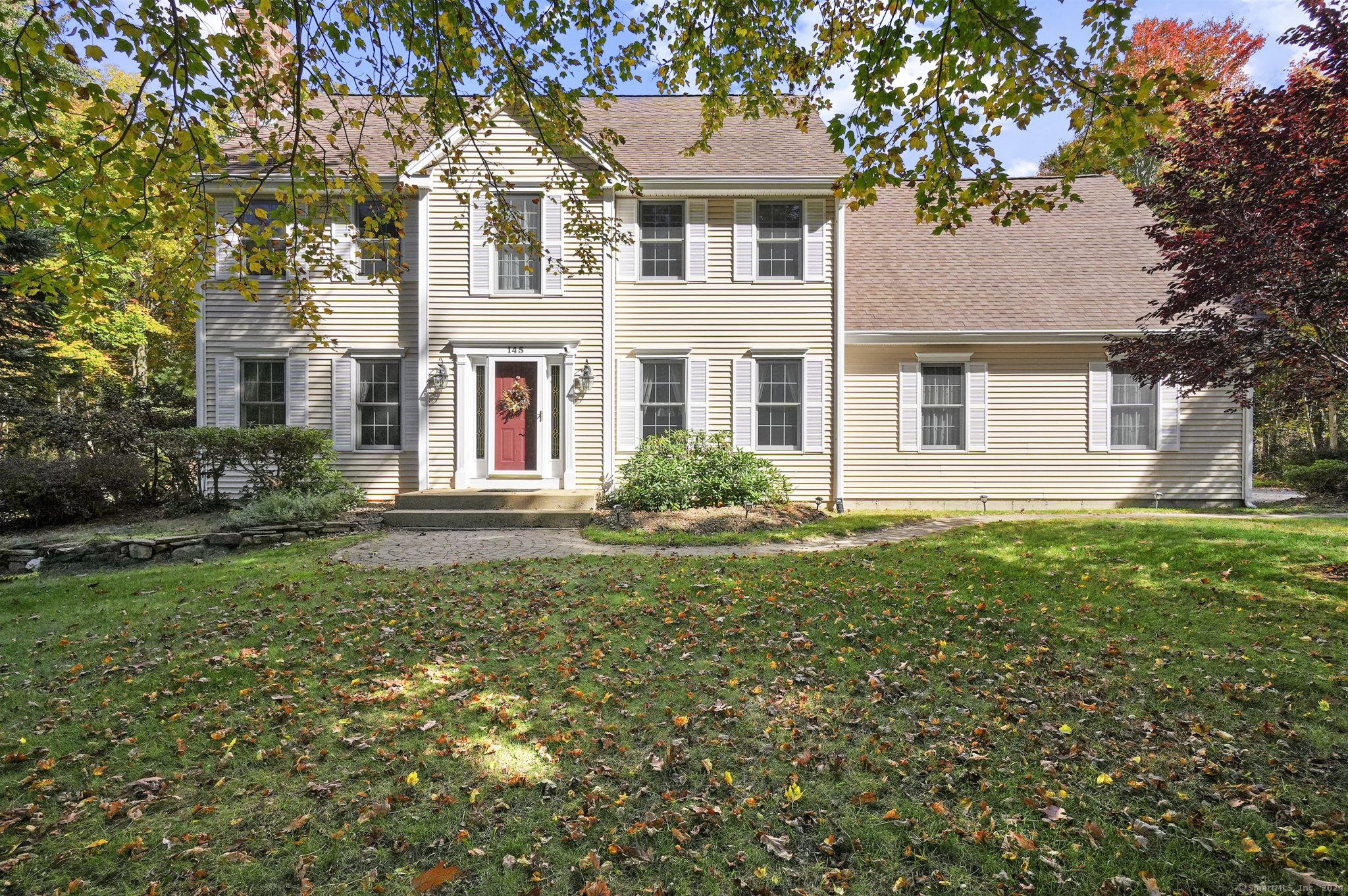 front view of a house with a yard