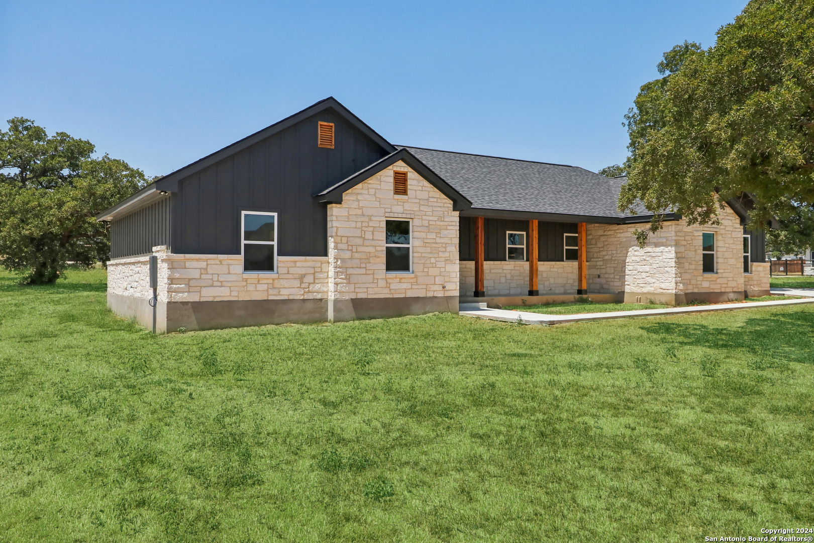 a front view of house with yard and green space