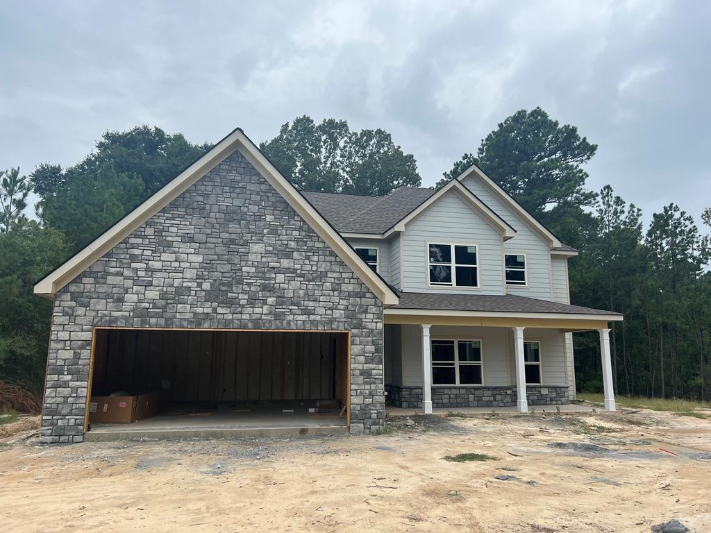 a front view of a house with garage