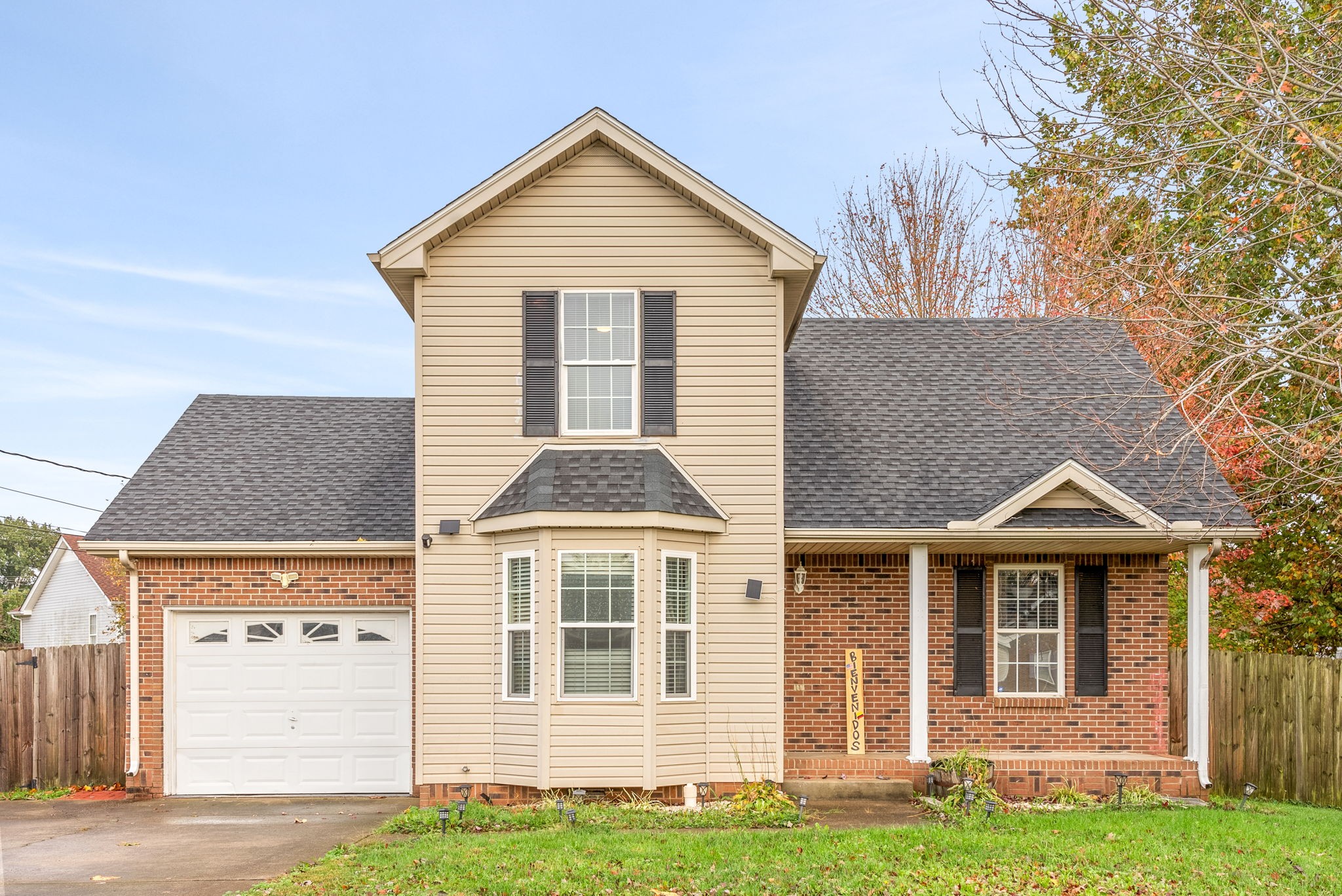 a front view of a house with a yard