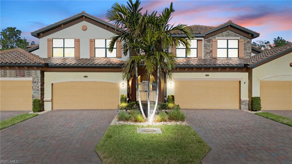 Mediterranean / spanish-style home featuring a garage