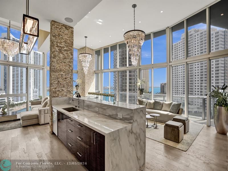 a kitchen with granite countertop a sink and a stove