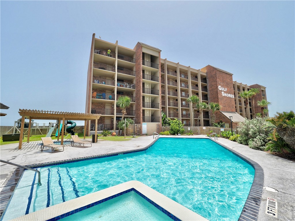 a view of a swimming pool with a patio