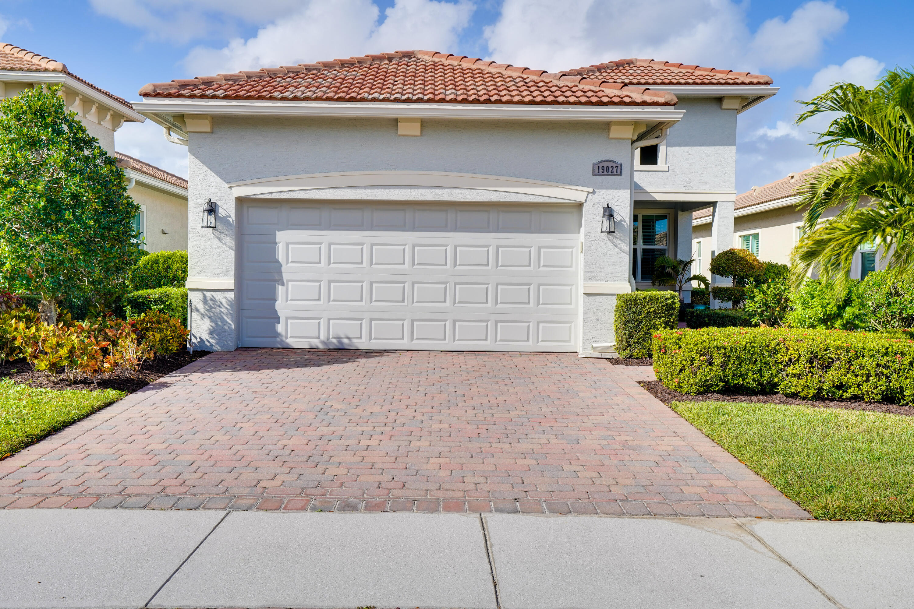 a front view of a house with a garage