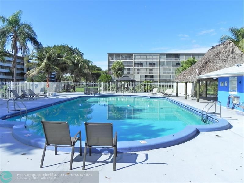 a view of a swimming pool with a patio