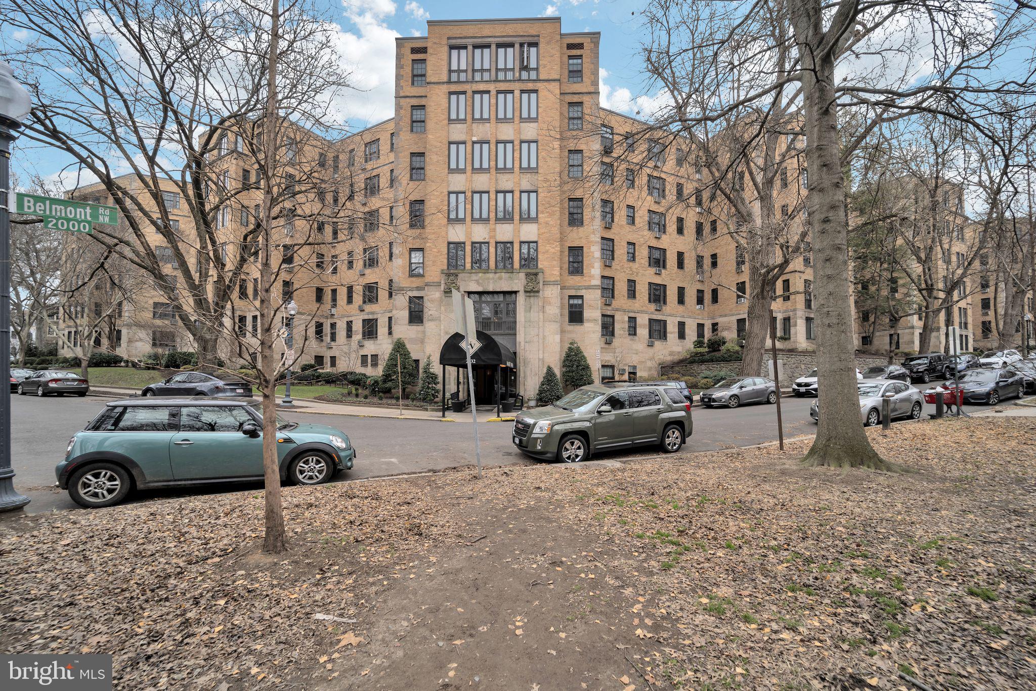 a view of street with parked cars