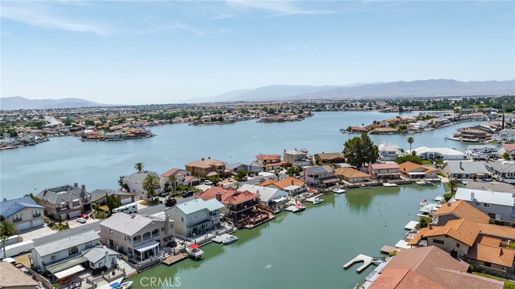 an aerial view of a city with lake view