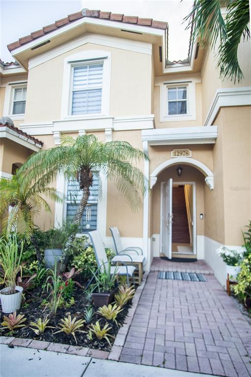 a front view of a house with garden