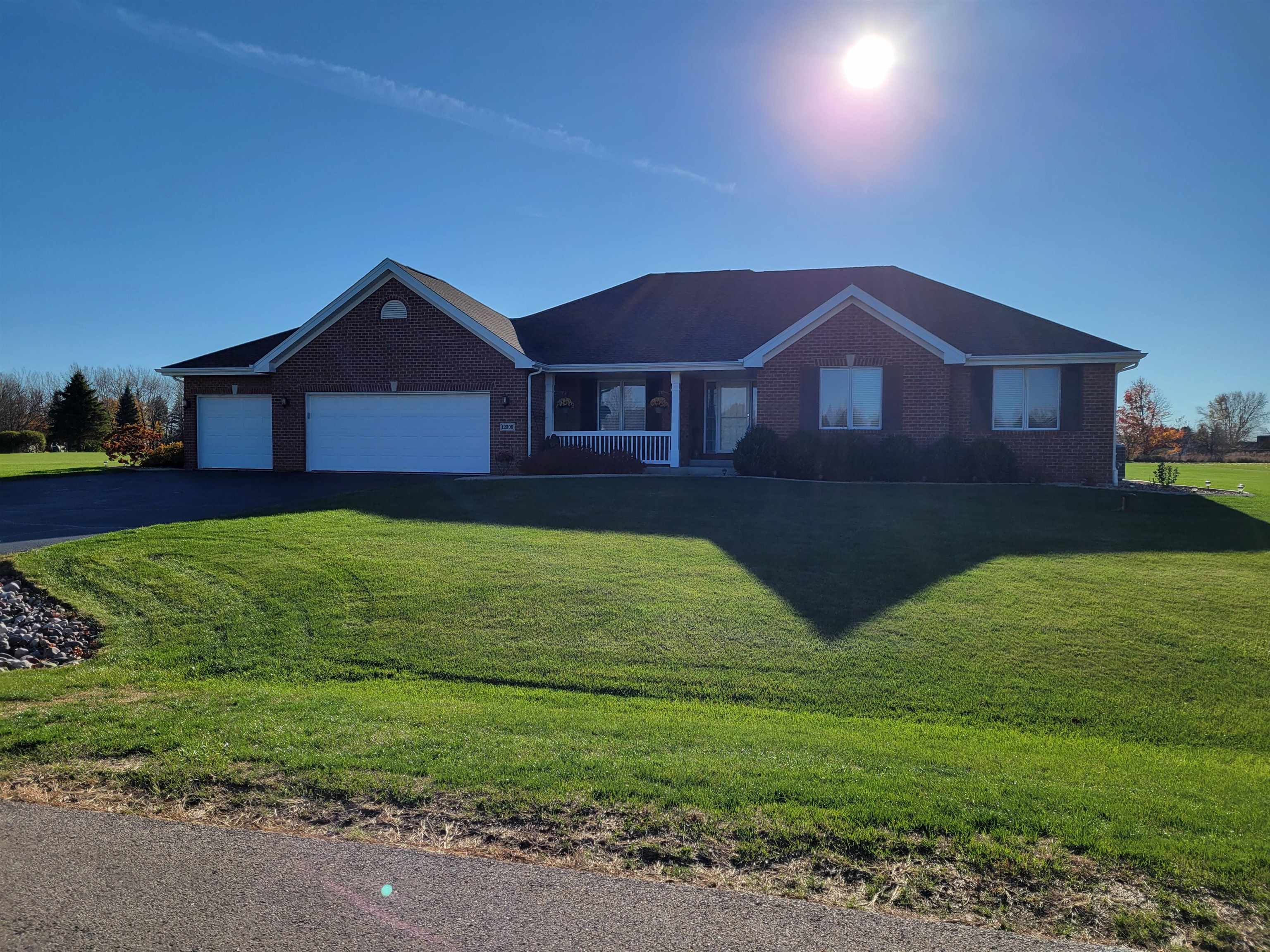 a view of a yard in front of a house with a yard