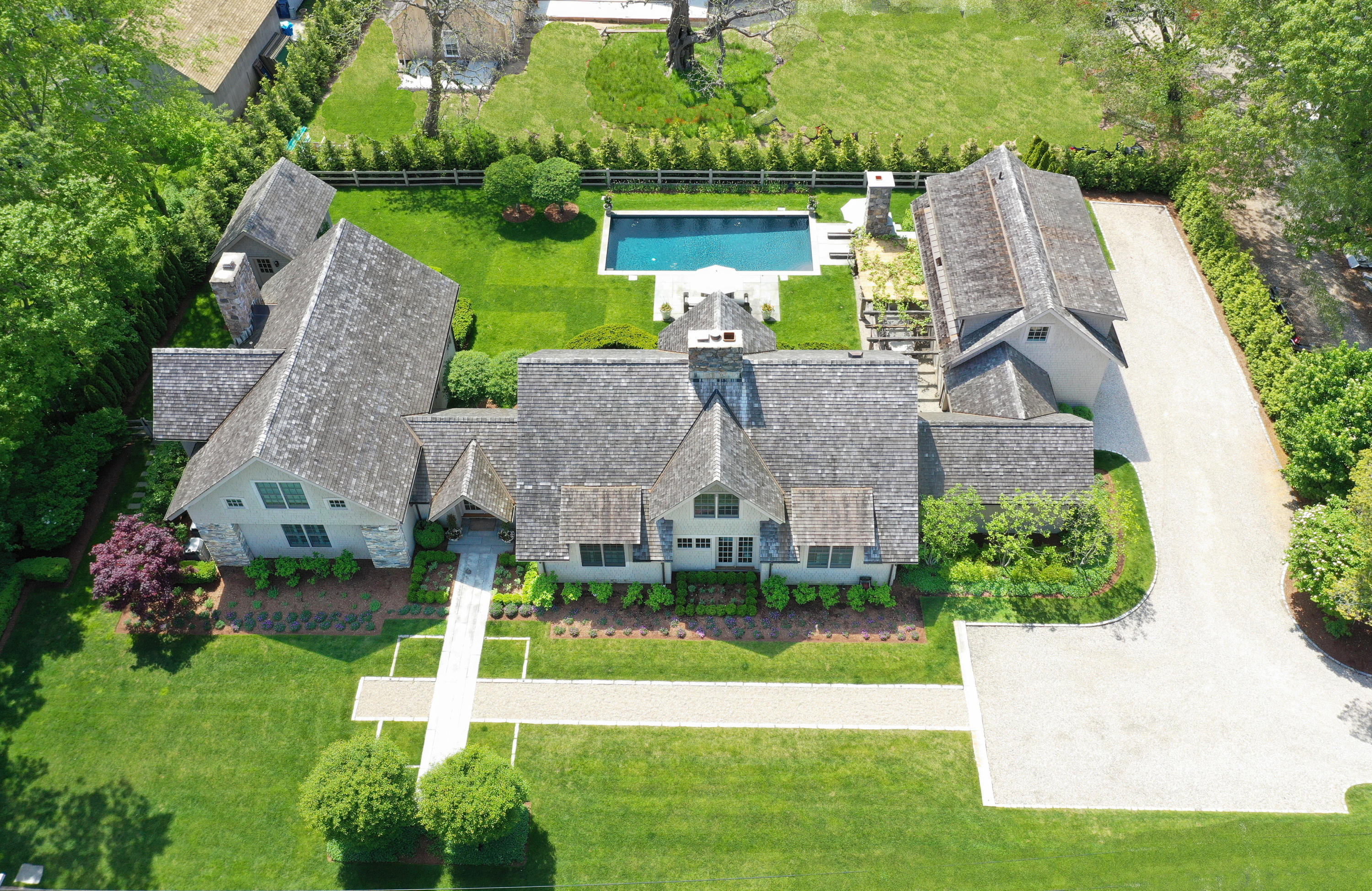 a aerial view of a house with a garden and plants