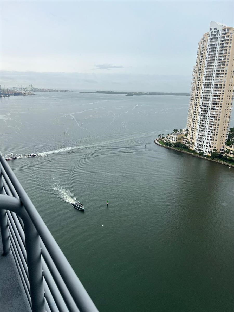 a view of a balcony with an ocean