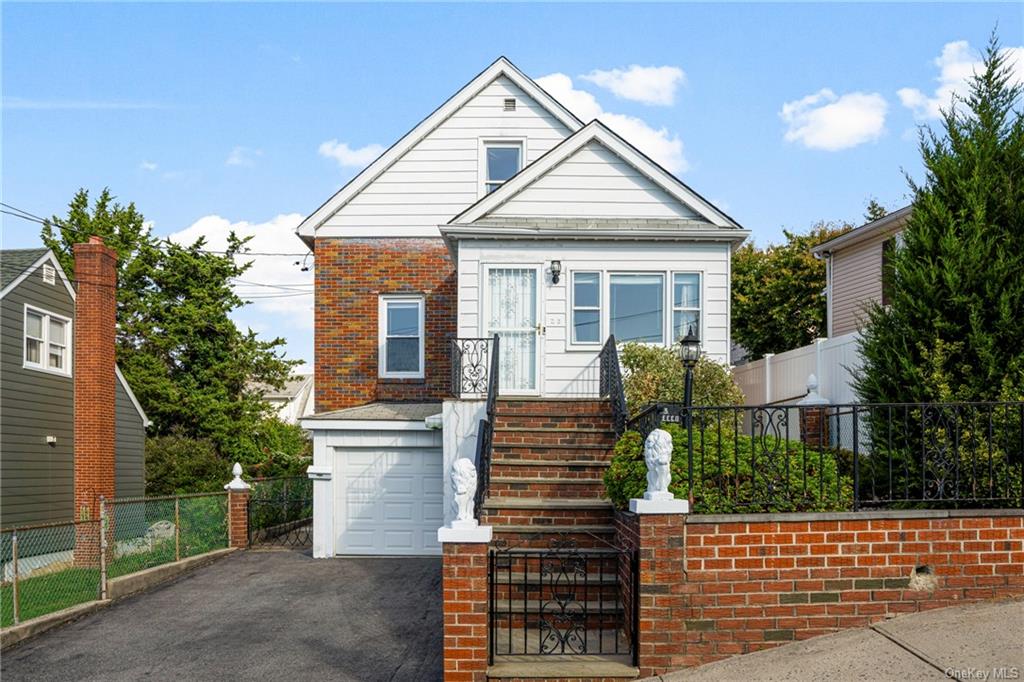 View of front of property featuring a garage