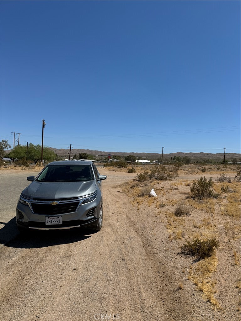 a car parked on the side of a beach